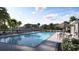 Community pool featuring shaded seating and lounging for residents at 2278 Blue Grosbeak Pl, Wimauma, FL 33598