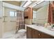 Bathroom featuring a shower and tub with a shower curtain, and a single sink vanity at 2436 Covington Ave, Spring Hill, FL 34608