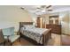 Comfortable bedroom featuring a ceiling fan, floral bedding, and complementary furniture at 2436 Covington Ave, Spring Hill, FL 34608