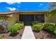Charming home featuring a secure front door, a well-lit walkway, and manicured landscaping at 2436 Covington Ave, Spring Hill, FL 34608
