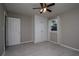Inviting bedroom with a ceiling fan, built-in storage, and window, creating a cozy and functional space at 2616 47Th N Ave, St Petersburg, FL 33714