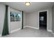 Bedroom features gray walls, a window with green curtains, and an open doorway at 2616 47Th N Ave, St Petersburg, FL 33714