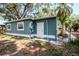 Rear view of a cozy home with a fenced yard, showcasing a back door entrance at 2616 47Th N Ave, St Petersburg, FL 33714