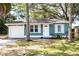 Charming single-story home with blue siding, white trim, and a well-maintained front yard at 2616 47Th N Ave, St Petersburg, FL 33714