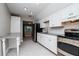 Spacious kitchen featuring stainless steel appliances, granite countertops, and modern backsplash at 2616 47Th N Ave, St Petersburg, FL 33714