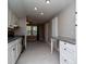 Updated kitchen featuring granite countertops, white cabinetry, stainless steel appliances and modern backsplash at 2616 47Th N Ave, St Petersburg, FL 33714
