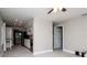 Open-concept living room with an adjoined kitchen, gray walls, and tile flooring at 2616 47Th N Ave, St Petersburg, FL 33714
