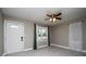 Bright living room with neutral walls, new tile flooring, and a modern ceiling fan at 2616 47Th N Ave, St Petersburg, FL 33714