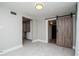 Living room features gray walls, light floors, and a sliding barn door at 2616 47Th N Ave, St Petersburg, FL 33714