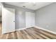 Bedroom with a closet and hardwood floors with an open doorway and neutral paint at 2696 60Th Avenue W Ter # 10, Bradenton, FL 34207