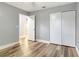 Bedroom featuring a spacious closet, hardwood floors, neutral walls and ample lighting at 2696 60Th Avenue W Ter # 10, Bradenton, FL 34207