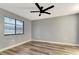 Bright bedroom with wood-look floors and a contemporary ceiling fan at 2696 60Th Avenue W Ter # 10, Bradenton, FL 34207