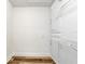 Walk-in closet with modern wood-look floors and shelving for ample storage at 2696 60Th Avenue W Ter # 10, Bradenton, FL 34207