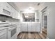 Bright, updated kitchen featuring white cabinets, modern appliances and a pass-through to the living area at 2696 60Th Avenue W Ter # 10, Bradenton, FL 34207