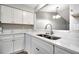 Updated kitchen boasting quartz countertops, modern cabinets, stainless faucet, and a stainless sink at 2696 60Th Avenue W Ter # 10, Bradenton, FL 34207