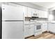 Updated kitchen with white cabinets, countertops, and modern appliances at 2696 60Th Avenue W Ter # 10, Bradenton, FL 34207