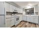 Updated kitchen with white cabinets, countertops, and modern appliances at 2696 60Th Avenue W Ter # 10, Bradenton, FL 34207