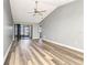 Well-lit living room boasting vaulted ceilings, stylish floors, and access to the outdoor patio at 2696 60Th Avenue W Ter # 10, Bradenton, FL 34207