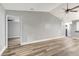 Clean living room showcasing vaulted ceilings, modern flooring, and open access to other rooms at 2696 60Th Avenue W Ter # 10, Bradenton, FL 34207
