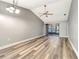Spacious living room with vaulted ceilings, new floors, and sliding glass doors to the patio at 2696 60Th Avenue W Ter # 10, Bradenton, FL 34207
