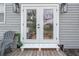 Back porch with french doors and chairs at 2700 10Th W St, Palmetto, FL 34221