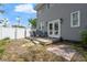 Back yard with a wooden deck and gray chairs at 2700 10Th W St, Palmetto, FL 34221