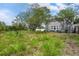 View of the home's expansive and well-maintained backyard at 2700 10Th W St, Palmetto, FL 34221