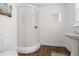 Cozy bathroom with a glass door shower and pedestal sink at 2700 10Th W St, Palmetto, FL 34221