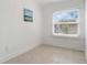 This secondary bedroom is sunlit, and features tile flooring at 2700 10Th W St, Palmetto, FL 34221