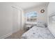 This bedroom has a cozy bed, closet, and a window that lets in natural light at 2700 10Th W St, Palmetto, FL 34221
