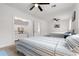 Bright bedroom with neutral paint, two ceiling fans, walk-in closet, and two beds at 2700 10Th W St, Palmetto, FL 34221