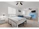 Bright bedroom with a blue brick fireplace and two twin beds at 2700 10Th W St, Palmetto, FL 34221
