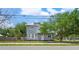 Charming two-story home features a neutral exterior, white trim, and welcoming curb appeal at 2700 10Th W St, Palmetto, FL 34221