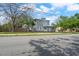Charming two-story home featuring a classic design, complemented by mature trees and a well-maintained yard at 2700 10Th W St, Palmetto, FL 34221