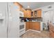 Well-lit kitchen with oak cabinets, granite counters, and modern appliances at 2700 10Th W St, Palmetto, FL 34221