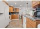 Cozy kitchen featuring oak cabinets, granite counters, and modern appliances at 2700 10Th W St, Palmetto, FL 34221