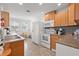 Charming kitchen featuring hardwood cabinets, tile backsplash, and ample natural light at 2700 10Th W St, Palmetto, FL 34221