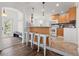 The open kitchen features a breakfast bar, tile floors, and abundant natural light at 2700 10Th W St, Palmetto, FL 34221