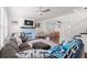 Spacious living room with modern ceiling fan, beautiful hardwood floors, and fireplace at 2700 10Th W St, Palmetto, FL 34221