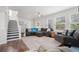 Spacious living room featuring cozy furniture, staircase and lots of natural light at 2700 10Th W St, Palmetto, FL 34221