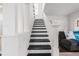 The staircase in this home is freshly painted with contrasting black and white at 2700 10Th W St, Palmetto, FL 34221