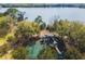Overhead view of a lakefront playground and picnic area with lush green space and recreational facilities at 2712 Clubhouse Dr, Plant City, FL 33566