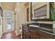 Elegant bathroom with granite countertops, a dark wood vanity, and a glass-enclosed shower at 2712 Clubhouse Dr, Plant City, FL 33566