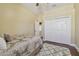 Comfortable bedroom with hardwood floors, a large closet, and neutral decor at 2712 Clubhouse Dr, Plant City, FL 33566