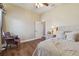 Bedroom featuring wood floors, neutral walls, and an upholstered arm chair at 2712 Clubhouse Dr, Plant City, FL 33566
