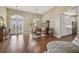 Elegant dining area with hardwood floors, chandelier, and a view of the front yard at 2712 Clubhouse Dr, Plant City, FL 33566