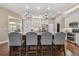 Open kitchen with a large center island, pendant lighting, and modern stainless steel appliances at 2712 Clubhouse Dr, Plant City, FL 33566