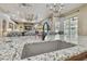 Open-concept kitchen featuring a granite countertop island with a modern faucet and sink at 2712 Clubhouse Dr, Plant City, FL 33566