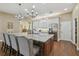 Gourmet kitchen boasts a granite island with seating, stainless appliances, and designer fixtures at 2712 Clubhouse Dr, Plant City, FL 33566