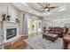 Inviting living room with fireplace, coffered ceiling, and sliding glass doors to the lanai at 2712 Clubhouse Dr, Plant City, FL 33566